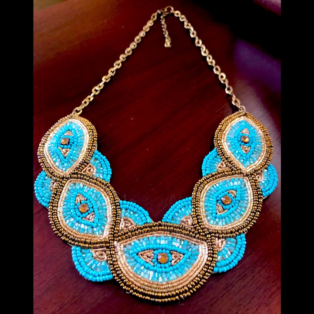 Pretty beaded turquoise necklace with fabric backing for lightweight wear.